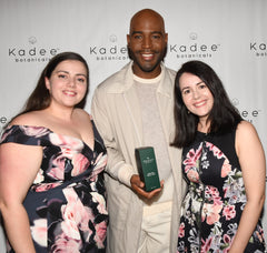 Karamo Brown from Queer Eye holding a Kadee Botanicals Body Lotion