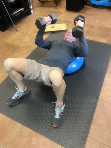 Dumbbell Presses on Bosu Ball for Core and Bicep Strength