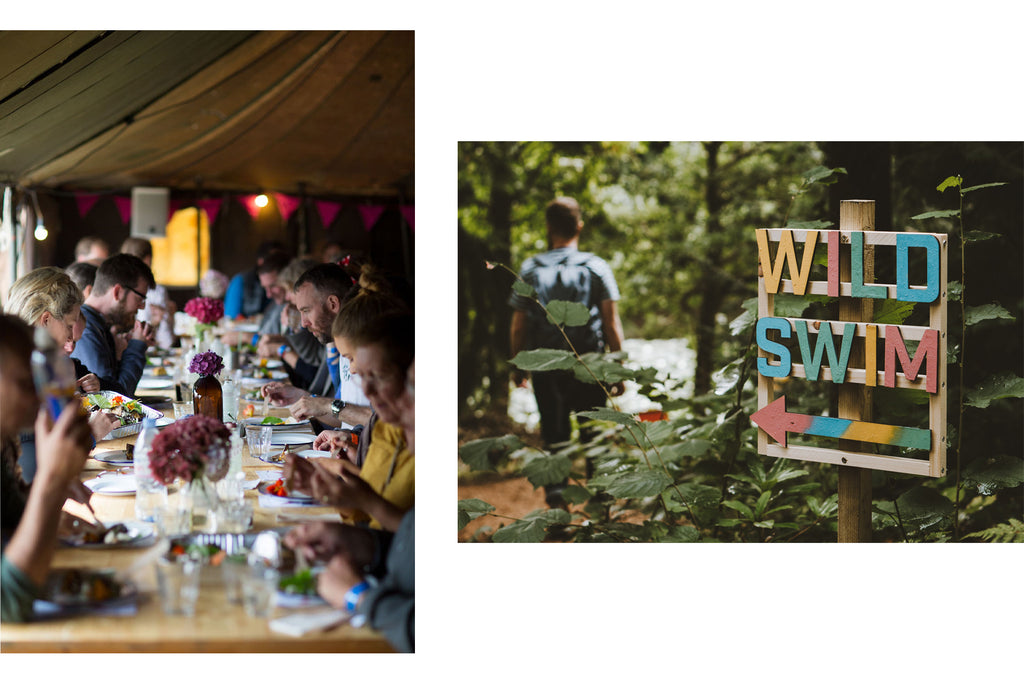 People eating and wooden wild swim sign at The Goodlife Experience