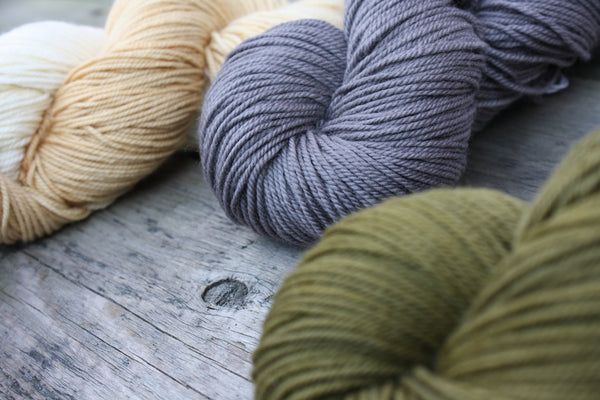 Naturally Dyed Yarn in olive, grey, and caramel