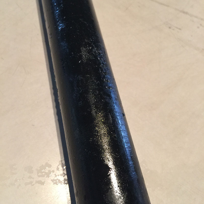 Iron pipes covered in grease and black paint. Ready to clean for booth display tables.