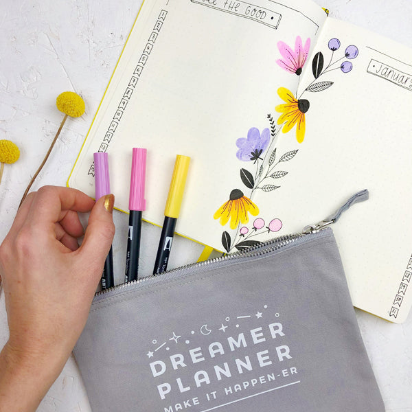 Floral Bullet journal spread with pastel tombows in a Joanne Hawker dreamer planner pouch.