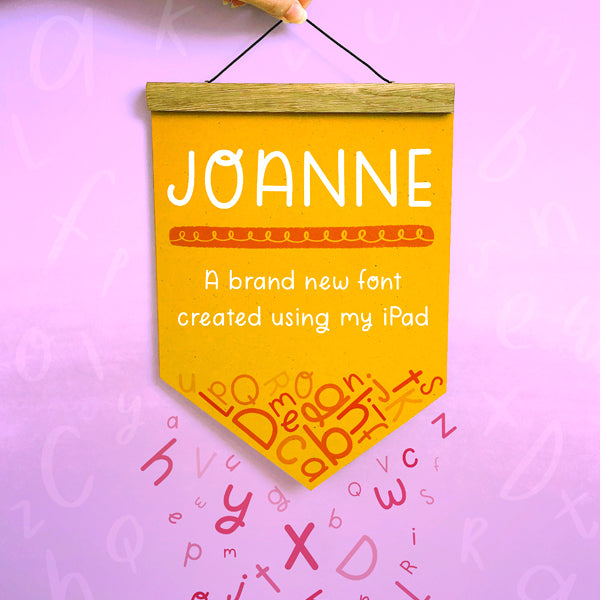 The font 'Joanne' that was created using an ipad set on a yellow banner flag on a purple background with pink letters falling off.