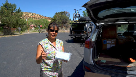 Health worker accepting mask donations