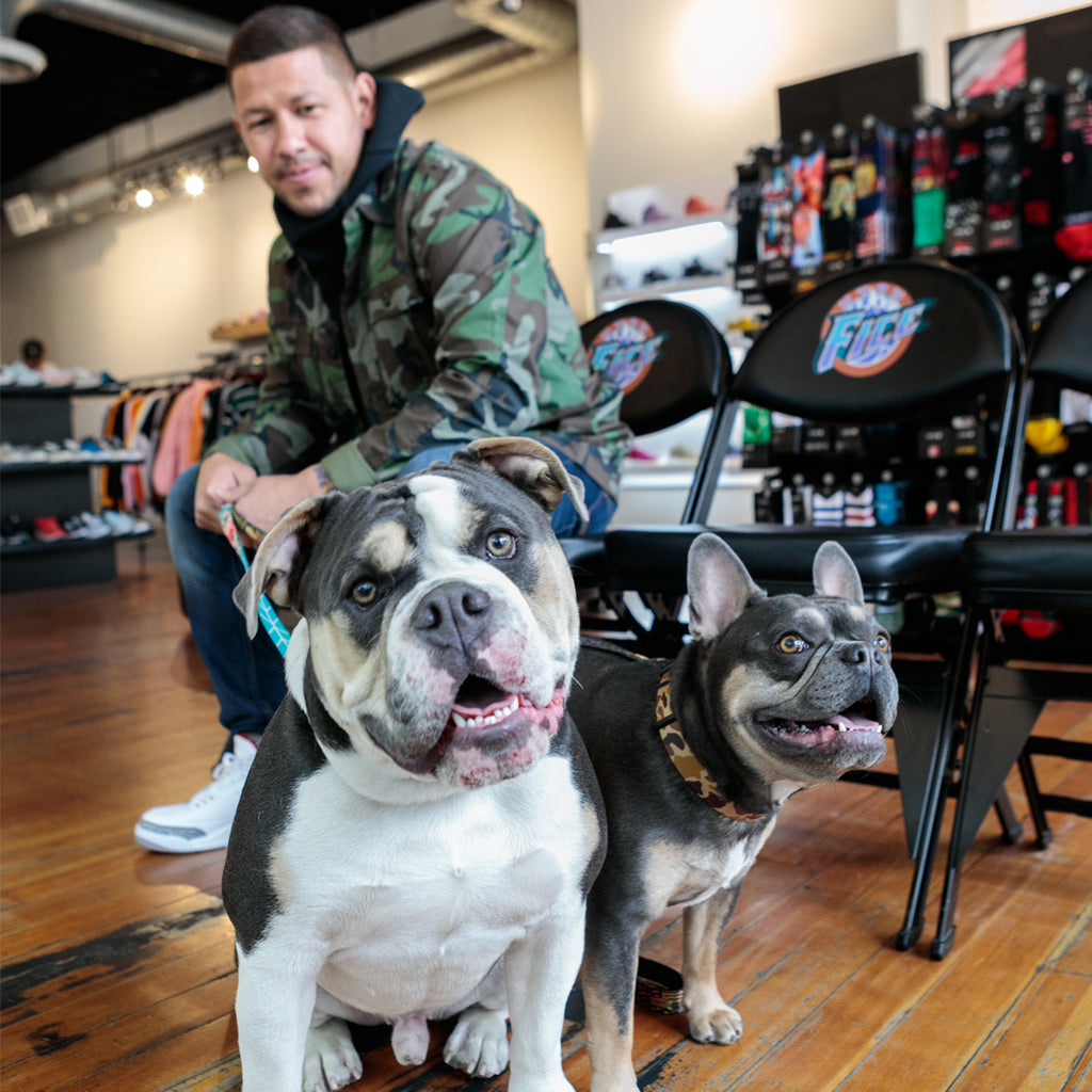 Nick Rimando in a shop with his dogs.