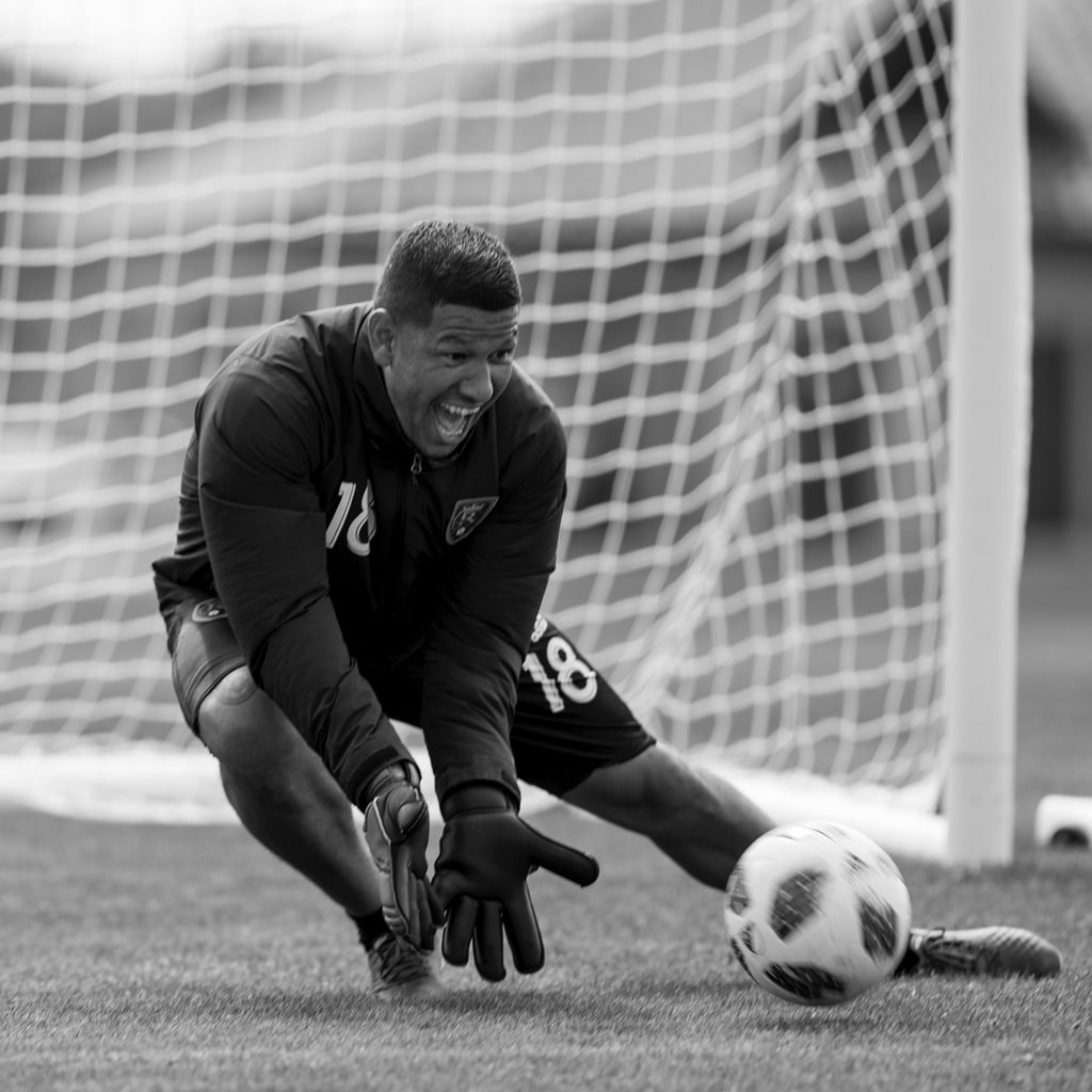 Nick Rimando blocking a shot on-goal.