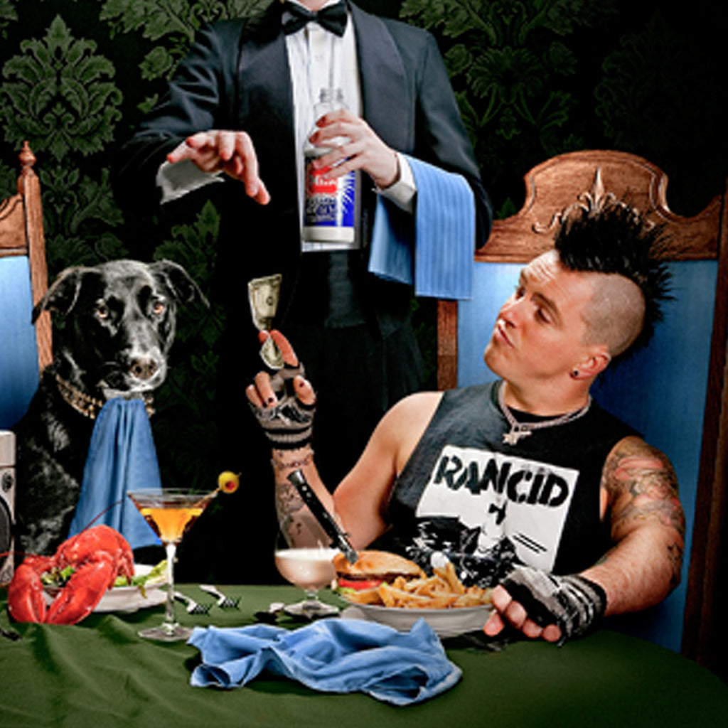 Brandon Steineckert and his dog Radio at a dinner table.