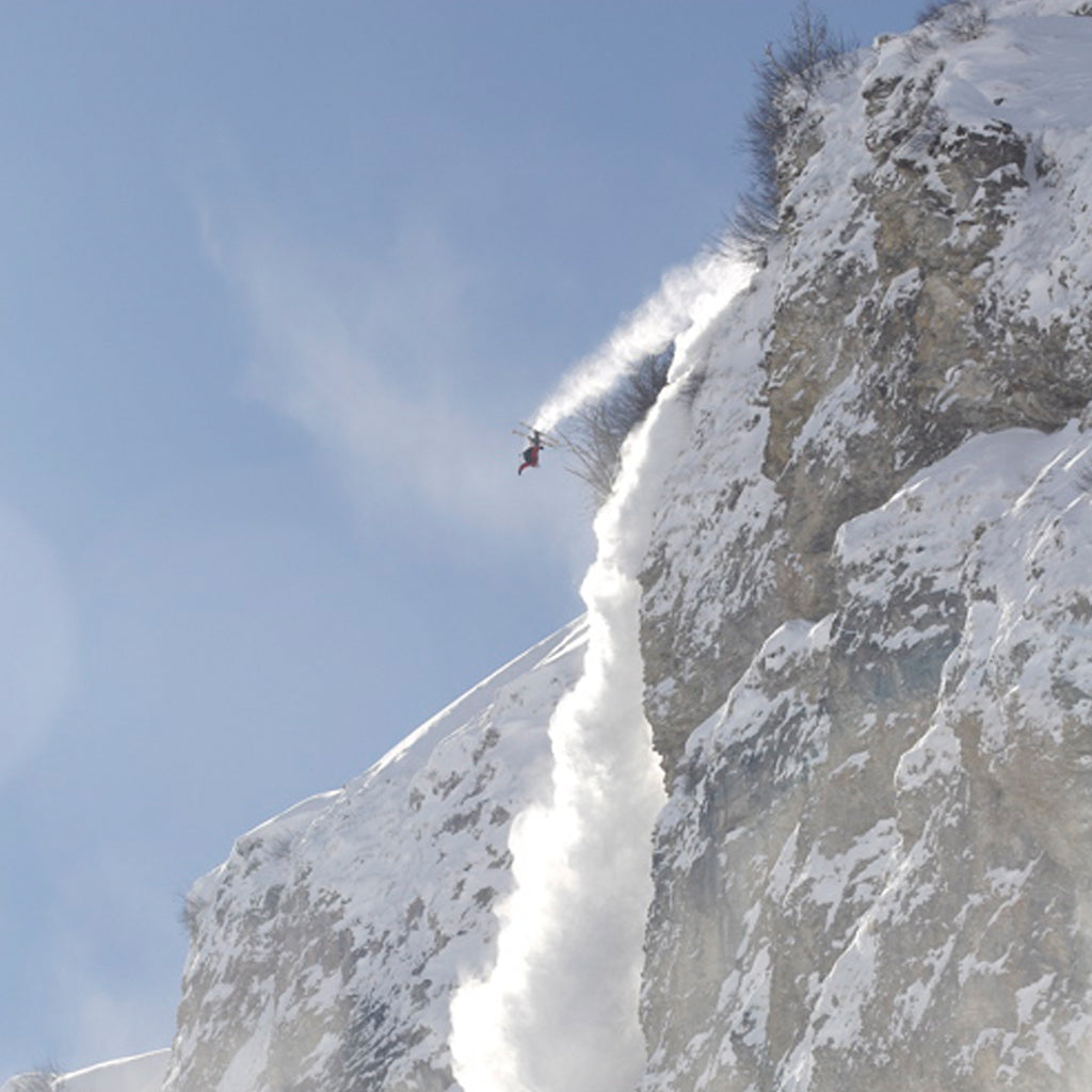 Pro skier Julian Carr jumping off a massive cliff.