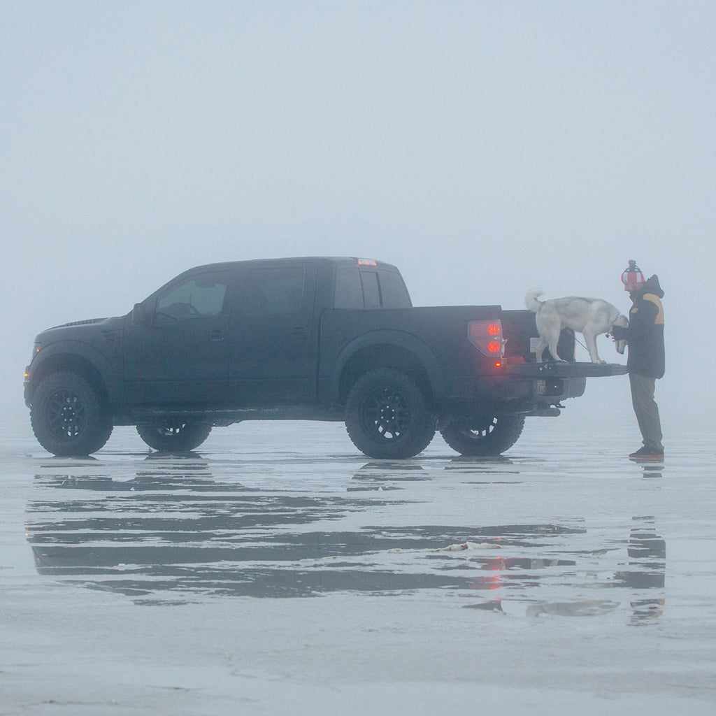 Ken Block with his dog Bentley in the back of his Ford Raptor on the Great Salt Lake.