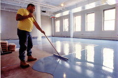 applying epoxy on a floor