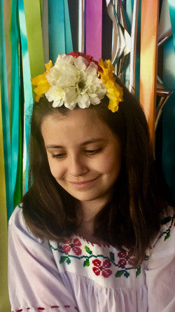 Child wearing fiesta flower crown