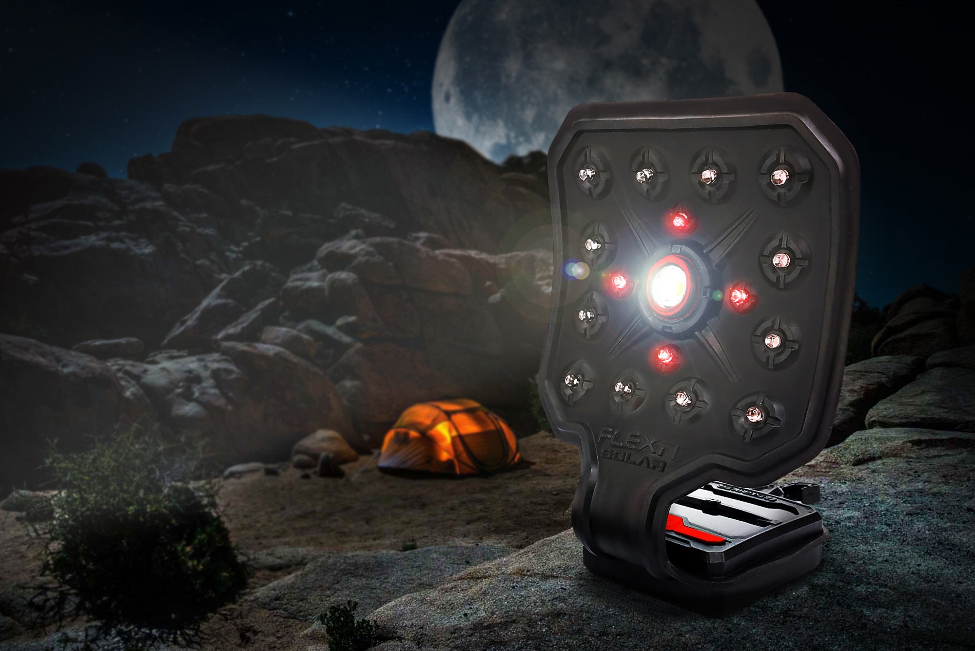 FLEXIT Solar Flexible Flashlight with Solar Charging Panel posing in a nighttime camping scene | STKR Concepts - striker