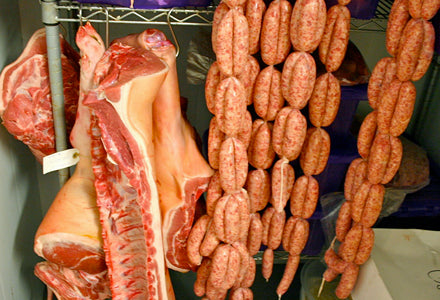 Freshly hung pork and sausages