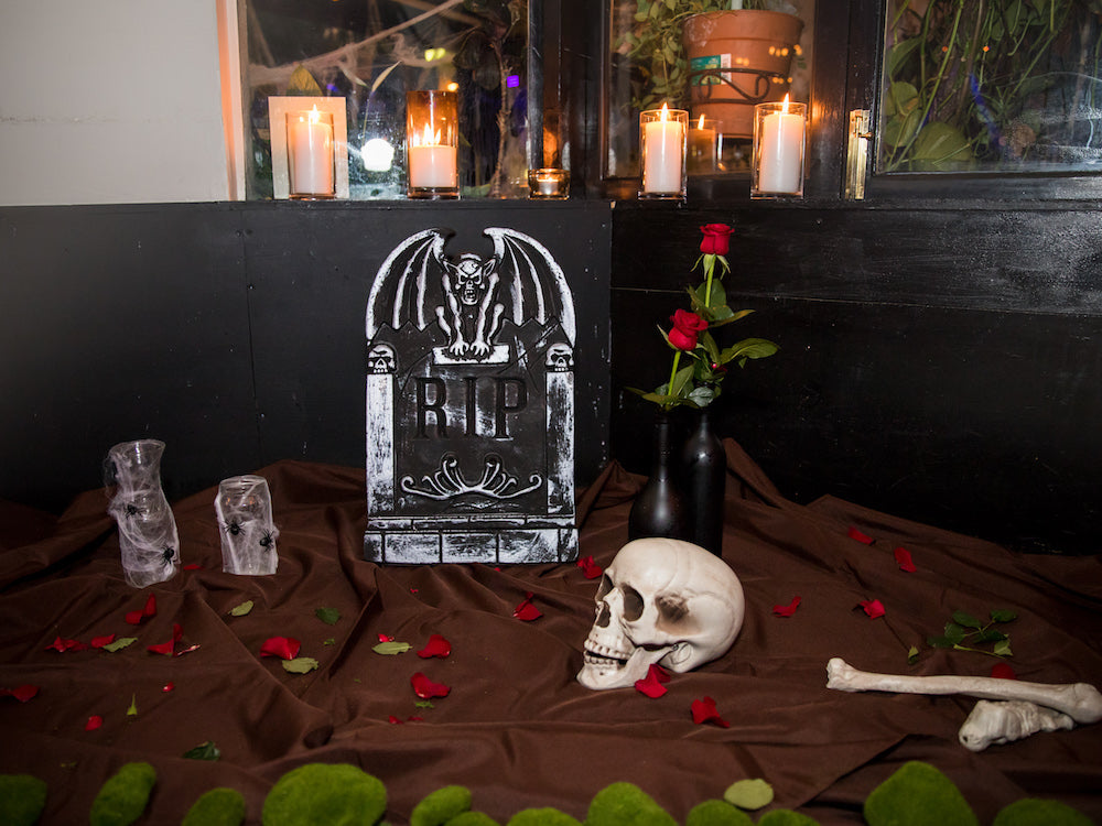 Halloween Decorations: DIY graveyard feature – gravestone, skeleton bones, spooky vase and moss 