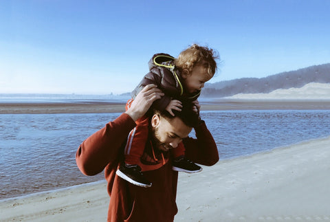 Father and child enjoying a day at the beach