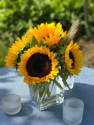 sunflowers in glass container by gig Morris florist Belmar, nj