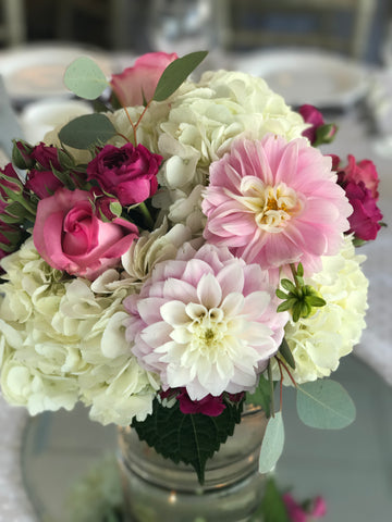 Floral Centerpieces done by gig Morris florist, nj at crystal point in pt. pleasant, nj with hydrangea, roses, spray roses, and dahlias in pinks and creams