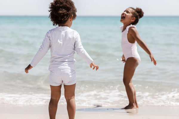 Willow Swim kids on beach playing - how to buy swimwear for kids