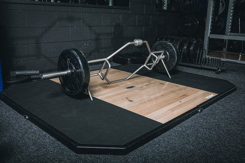York Barbell Dead Lift & Shrug Bar loaded with Rubber Bumper Plates