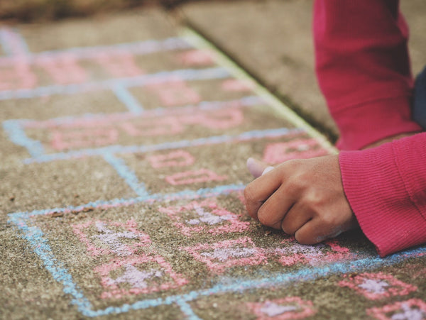 Drawing on sidewalk with chalk