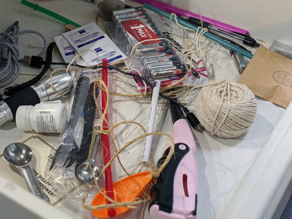 Junk drawer organization before photo