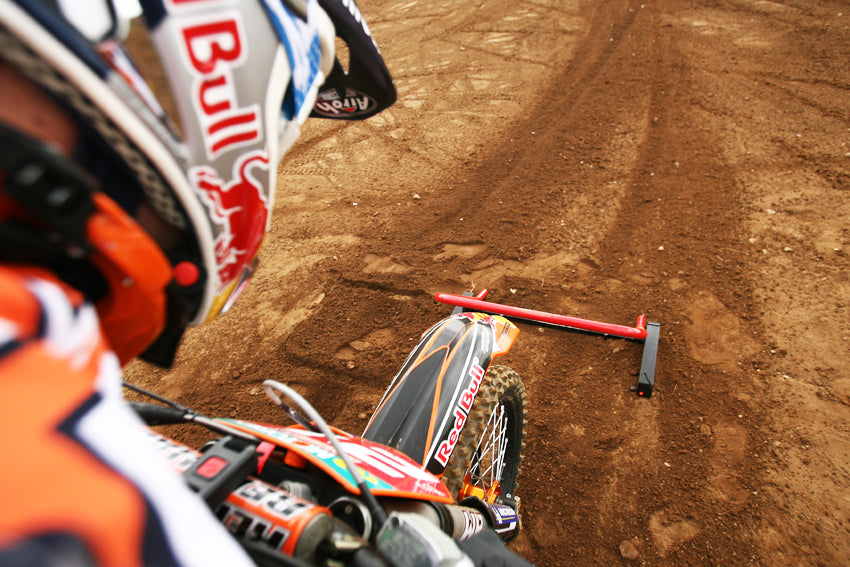 Extreme close of a MX racer taking off as their Risk Racing Holeshot race gate drops