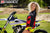 September's Risk Racing Moto Model Denna Lynn posing in various bikinis & Risk Racing Jerseys next to a dirt bike that's sitting on a Risk Racing ATS stand - Pose #6
