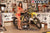 August's Risk Racing Moto Model Samantha Heady posing in various bikinis & Risk Racing Jerseys next to a dirt bike that's sitting on a Risk Racing ATS stand - Pose #18
