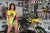 August's Risk Racing Moto Model Samantha Heady posing in various bikinis & Risk Racing Jerseys next to a dirt bike that's sitting on a Risk Racing ATS stand - Pose #21