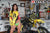 August's Risk Racing Moto Model Samantha Heady posing in various bikinis & Risk Racing Jerseys next to a dirt bike that's sitting on a Risk Racing ATS stand - Pose #30