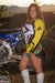 December's Risk Racing Moto Model Kelly Perez posing in various bikinis and Risk Racing Jerseys next to a dirt bike that's sitting on a Risk Racing ATS stand - Pose #21