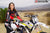 October's Risk Racing Moto Model Jessica Victorino posing in various bikinis and Risk Racing Jerseys next to a dirt bike that's sitting on a Risk Racing RR1-Ride-On stand - Pose #36