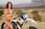 October's Risk Racing Moto Model Jessica Victorino posing in various bikinis and Risk Racing Jerseys next to a dirt bike that's sitting on a Risk Racing RR1-Ride-On stand - Pose #40