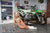 Risk Racing Moto Model Rachel Strait posing in various bikinis and Risk Racing Jerseys next to a dirt bike that's sitting on a Risk Racing ATS stand - Pose #7