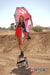 Risk Racing's June Moto Model Rochelle Roche wearing a Risk Racing Factory Pit Dry-Fit Shirt and black boots standing on one leg up on top of an ATS Stand and holding a factory Umbrella. MX track in the background.