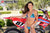 July's Risk Racing Moto Model Samantha Heady posing in various bikinis & Risk Racing Jerseys next to Alex Ray's Honda CR250R that's sidding on a Risk Racing ATS stand - Pose #11