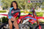 July's Risk Racing Moto Model Samantha Heady posing in various bikinis & Risk Racing Jerseys next to Alex Ray's Honda CR250R that's sidding on a Risk Racing ATS stand - Pose #20