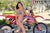 July's Risk Racing Moto Model Samantha Heady posing in various bikinis & Risk Racing Jerseys next to Alex Ray's Honda CR250R that's sidding on a Risk Racing ATS stand - Pose #21