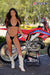 July's Risk Racing Moto Model Samantha Heady posing in various bikinis & Risk Racing Jerseys next to Alex Ray's Honda CR250R that's sidding on a Risk Racing ATS stand - Pose #38