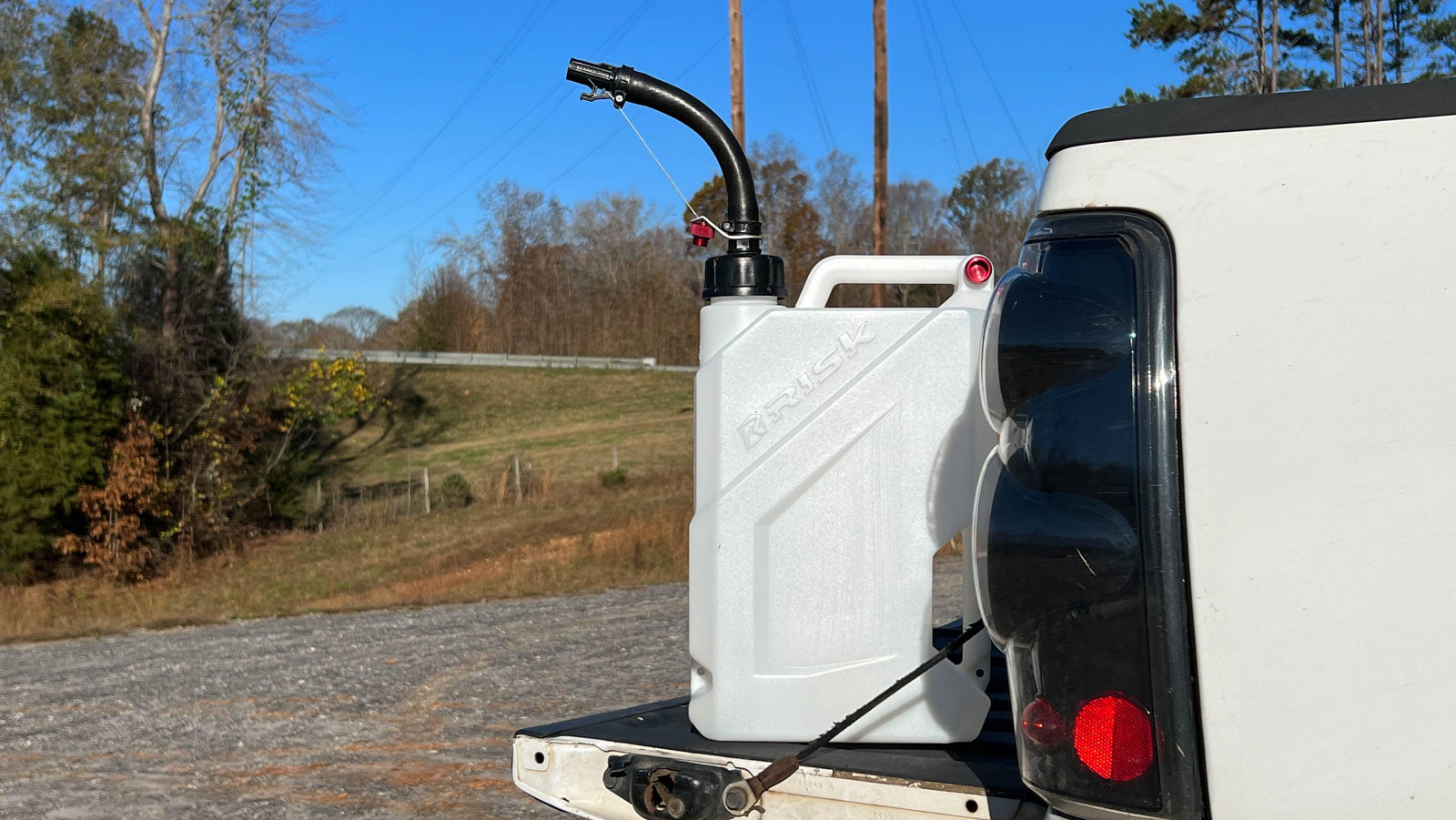 EZ Jug shown sitting on the tailgate of a truck in an outdoor scene