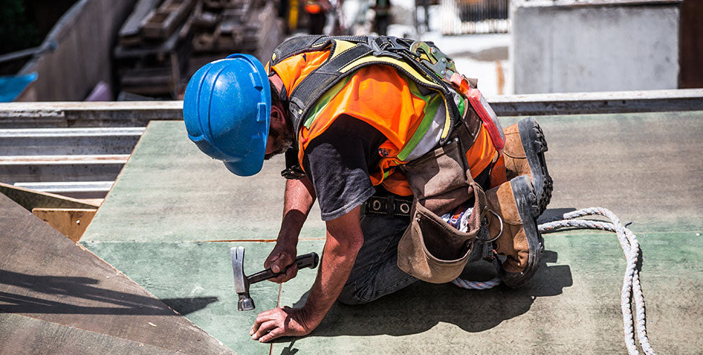 Work man wearing head protection on building site