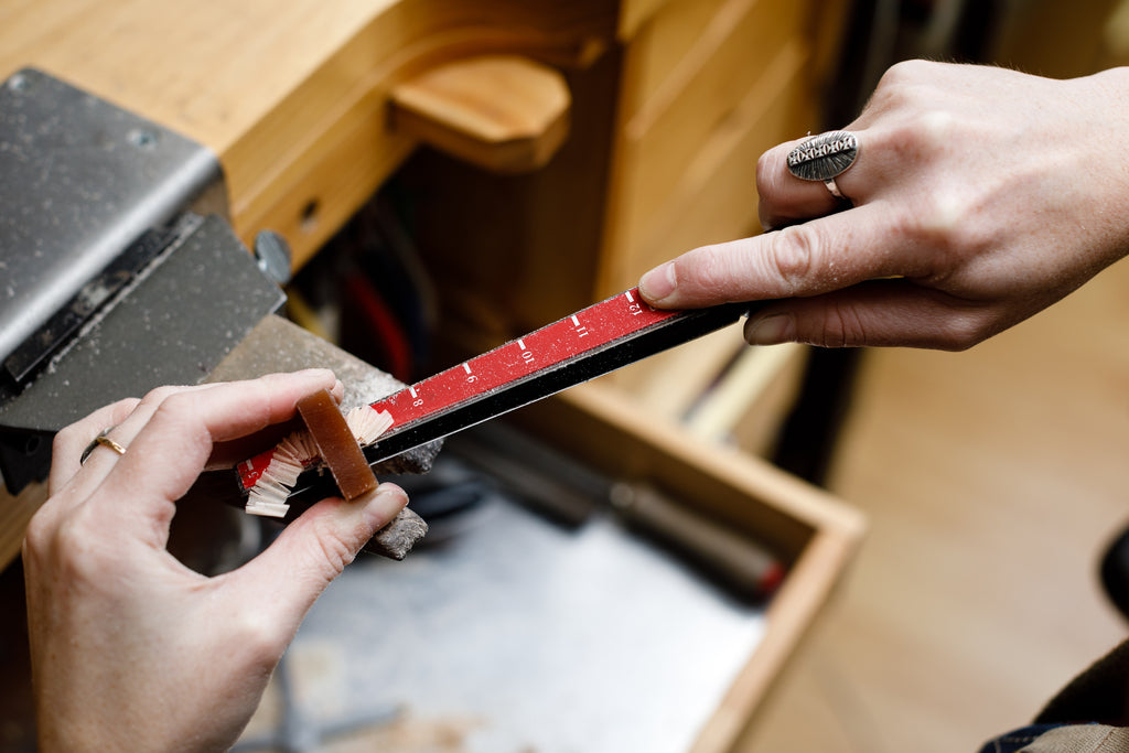 Enlarging the hole to the desired finger size - How a Ring is Made - Corey Egan