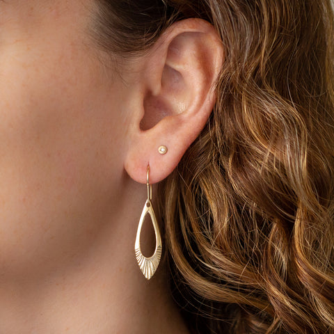 Vermeil Flux Earrings on the ear