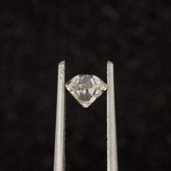 Old Mine Cut Diamond in Tweezers - Side View