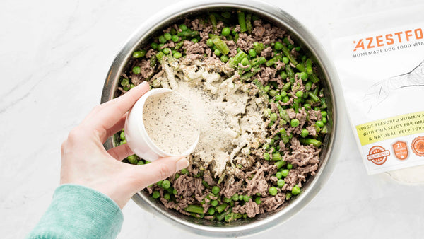 when cooked dog food ingredients have cooked add vitamins and minerals