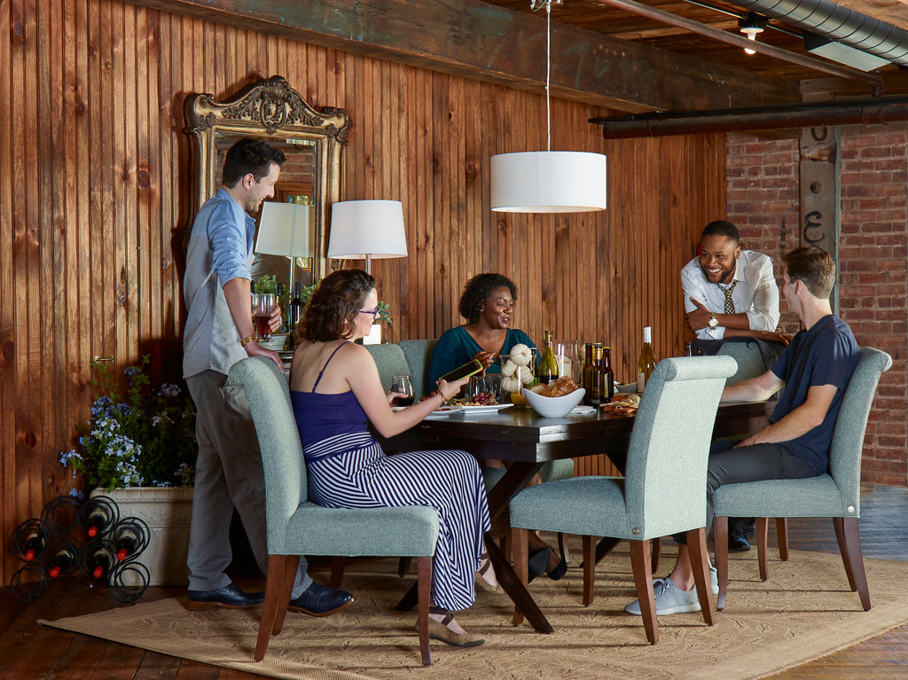 Dinner party with friends, sitting in Cudo's Rosemary Dining Chairs