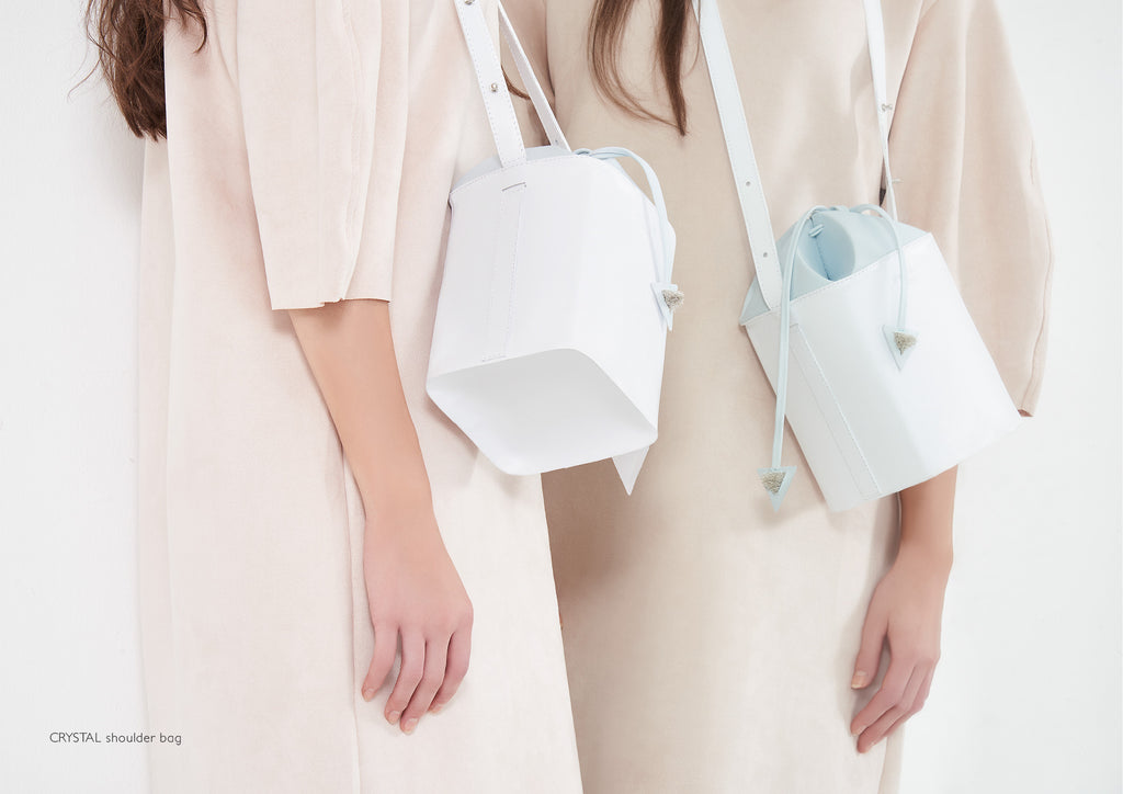 Dream's Code white and light blue leather bucket bag with origami artwork