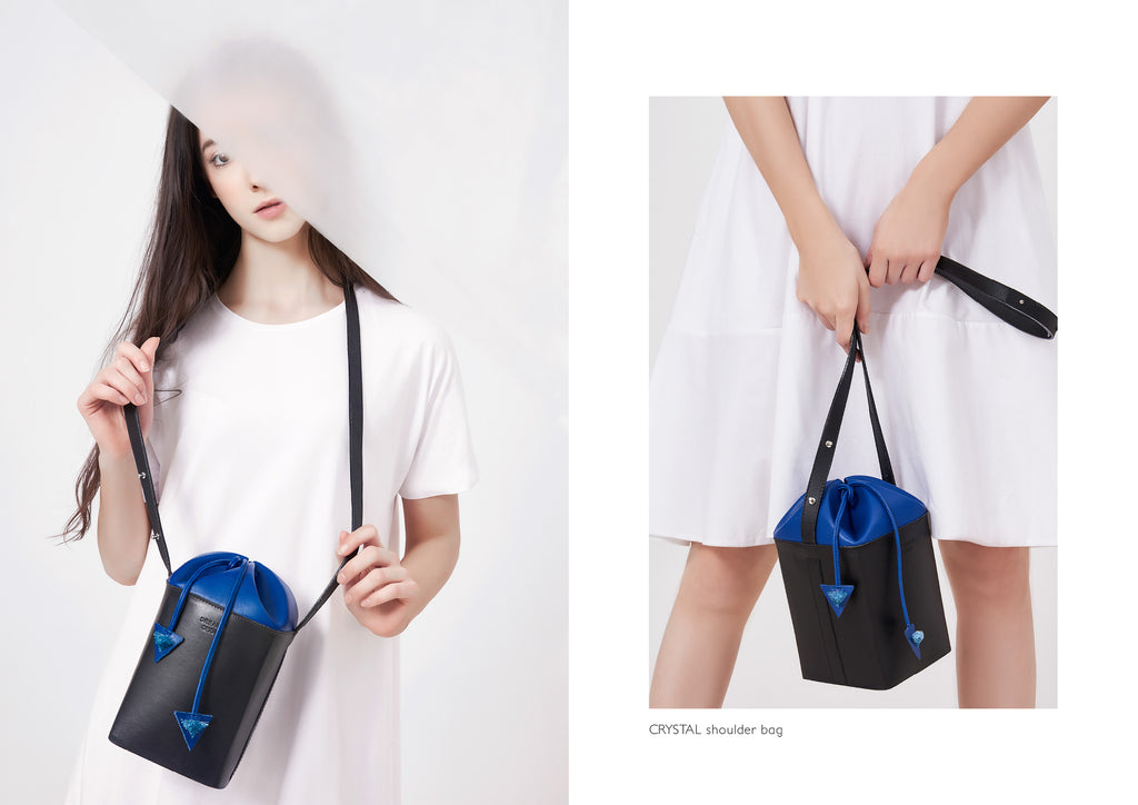 Dream's Code black and electric blue leather bucket bag with origami artwork