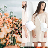 Dream's Code Flake bucket bag and the orange flower field