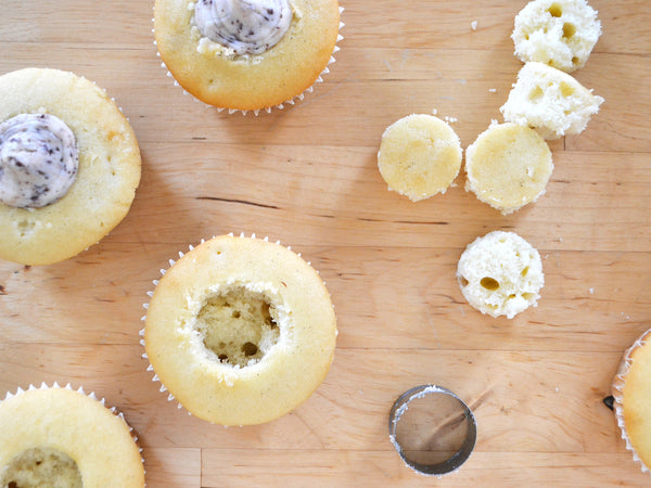 Filling cupcakes with chocolate chip cannoli cream